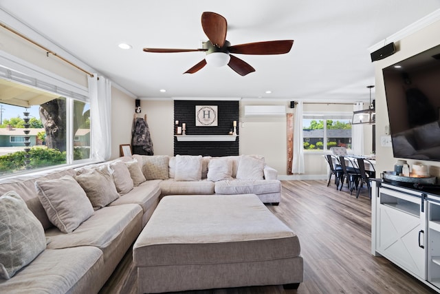 3689 Suzanne Way, Redding, CA 96002 - living room with a ceiling fan, a wall mounted air conditioner, dark wood finished floors, recessed lighting, and baseboards