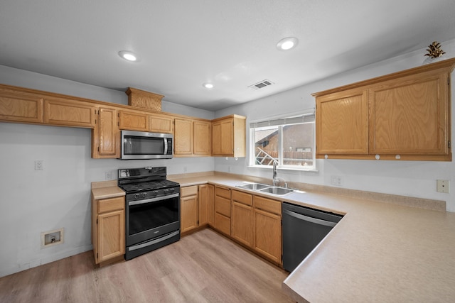 1706 Stanton Dr, Shasta Lake, CA 96019 - kitchen with stainless steel appliances, light countertops, light wood finished floors, and recessed lighting