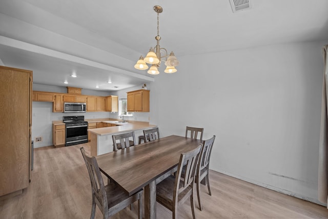 1706 Stanton Dr, Shasta Lake, CA 96019 - dining room with a chandelier, light wood-type flooring, and recessed lighting
