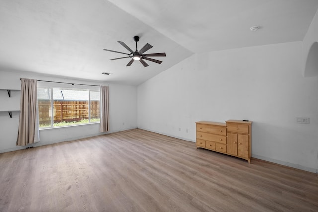 1706 Stanton Dr, Shasta Lake, CA 96019 - unfurnished room featuring light wood-style flooring, a ceiling fan, vaulted ceiling, and a smoke detector