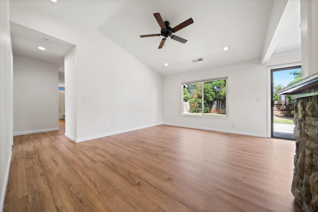 empty room with light wood-style floors, vaulted ceiling, a ceiling fan, recessed lighting, and baseboards