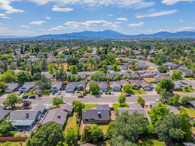 aerial view of residential area featuring a mountainous background