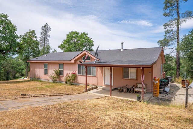 16605 Lassen Ave, Anderson, CA 96007 - ranch-style house with a front yard, a patio area, and a shingled roof