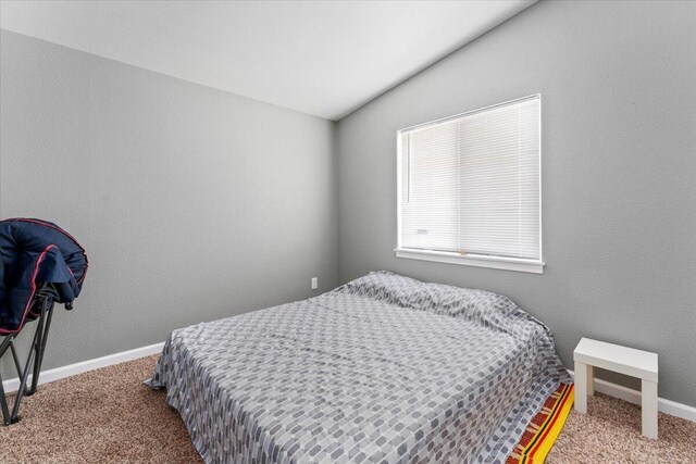 16605 Lassen Ave, Anderson, CA 96007 - bedroom featuring vaulted ceiling, carpet, and baseboards