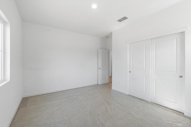 5555 Feathers Ave, Redding, CA 96002 - unfurnished bedroom featuring carpet floors, baseboards, and a closet