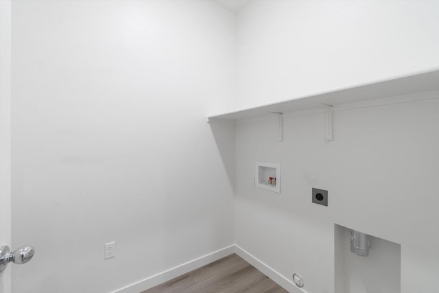 5555 Feathers Ave, Redding, CA 96002 - laundry room featuring light wood-style flooring, hookup for a washing machine, baseboards, and electric dryer hookup