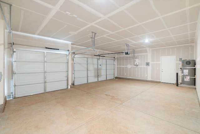 5555 Feathers Ave, Redding, CA 96002 - garage featuring water heater and a garage door opener