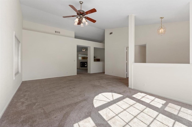 1366 Carla Cir, Redding, CA 96003 - carpeted spare room with vaulted ceiling, a ceiling fan, and a chandelier
