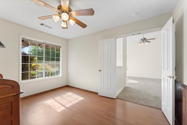 1366 Carla Cir, Redding, CA 96003 - empty room featuring wood finished floors, ceiling fan, and baseboards