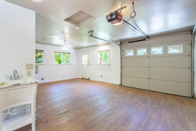 1556 Santa Fe Ave, Redding, CA 96003 - garage with a garage door opener and baseboards