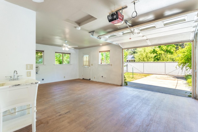 1556 Santa Fe Ave, Redding, CA 96003 - garage with a garage door opener, baseboards, and ceiling fan