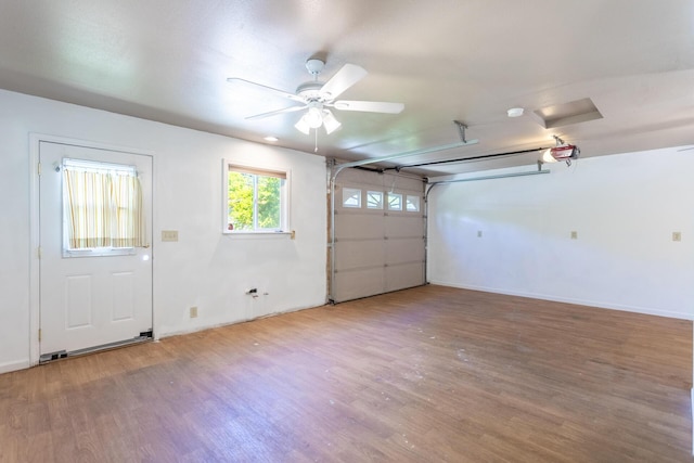 1556 Santa Fe Ave, Redding, CA 96003 - garage featuring a garage door opener, baseboards, and ceiling fan
