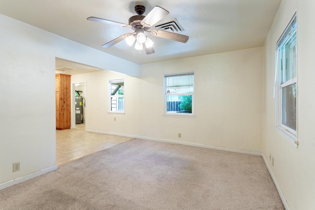 1556 Santa Fe Ave, Redding, CA 96003 - unfurnished room with carpet flooring, water heater, baseboards, and ceiling fan