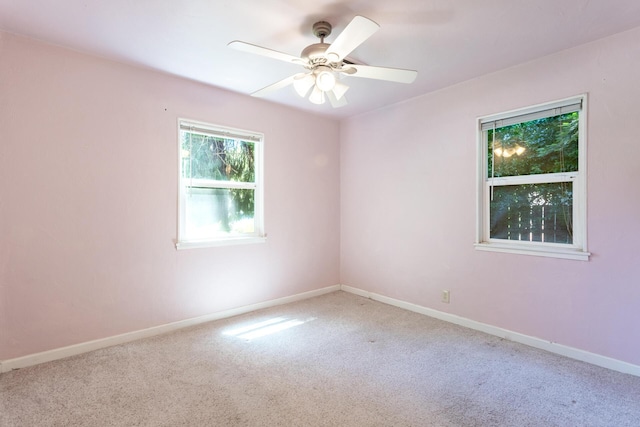 1556 Santa Fe Ave, Redding, CA 96003 - empty room with carpet floors, a ceiling fan, and baseboards