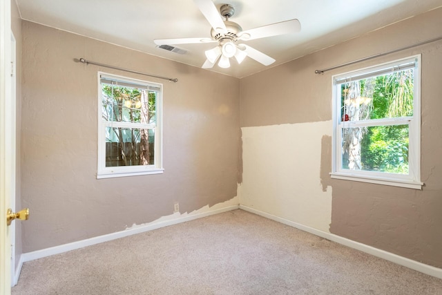 1556 Santa Fe Ave, Redding, CA 96003 - spare room featuring healthy amount of natural light, carpet, a ceiling fan, and baseboards