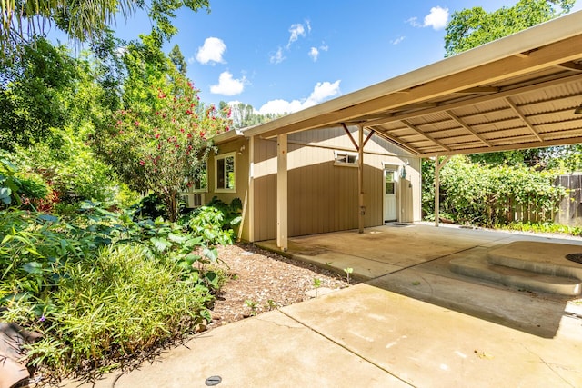 1556 Santa Fe Ave, Redding, CA 96003 - view of parking with fence and a carport