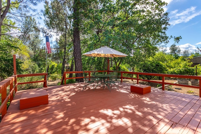 wooden deck featuring outdoor dining space