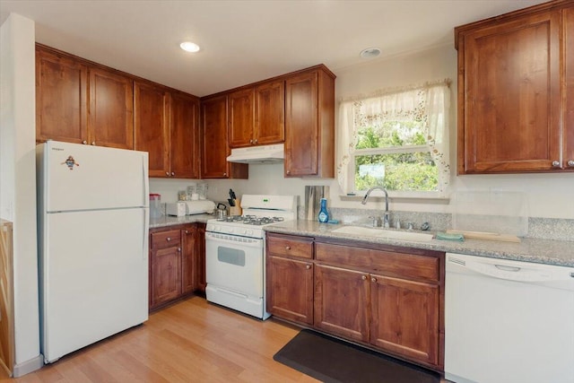 2125 Lava, Mccloud, CA 96057 - kitchen with white appliances, a sink, under cabinet range hood, light wood-style flooring, and brown cabinets