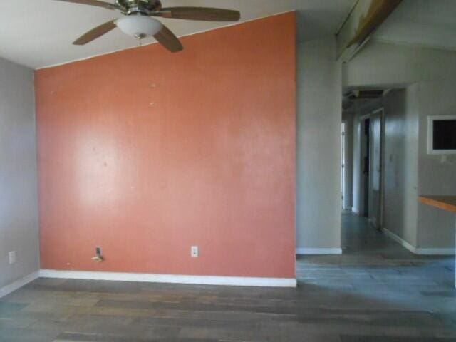 1090 Crooked Oak Ln, Redding, CA 96003 - spare room featuring wood finished floors, ceiling fan, baseboards, and lofted ceiling