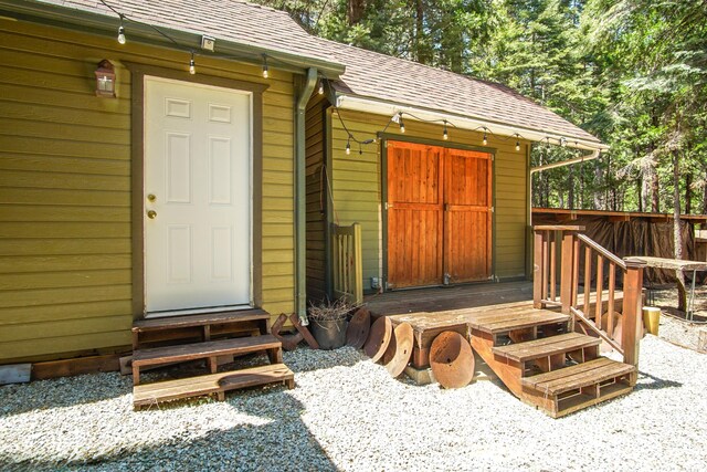 7289 Clarabelle Ln, Shingletown, CA 96088 - property entrance with roof with shingles