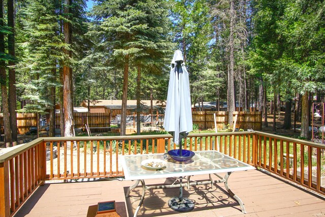 7289 Clarabelle Ln, Shingletown, CA 96088 - wooden terrace with outdoor dining space
