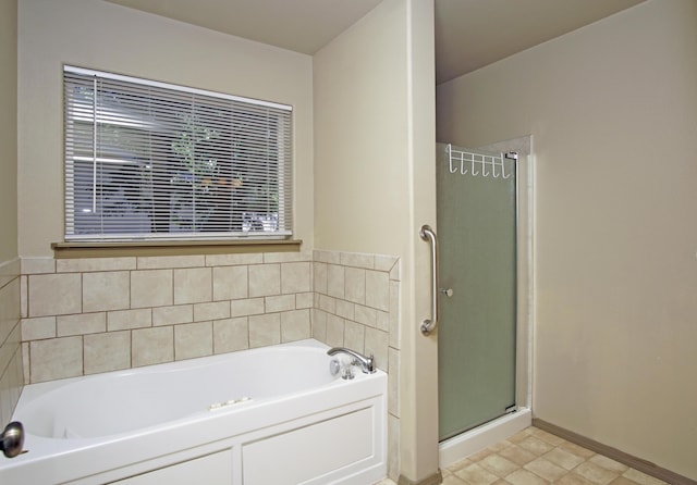 7289 Clarabelle Ln, Shingletown, CA 96088 - full bathroom with a stall shower, a bath, and baseboards