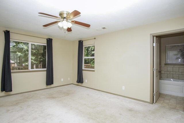 7289 Clarabelle Ln, Shingletown, CA 96088 - unfurnished bedroom with carpet, multiple windows, baseboards, and connected bathroom