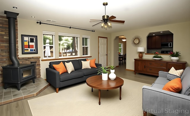 7289 Clarabelle Ln, Shingletown, CA 96088 - living room with a wood stove, light wood-style floors, ceiling fan, and recessed lighting