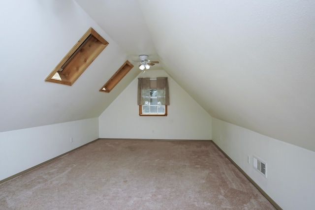 7289 Clarabelle Ln, Shingletown, CA 96088 - bonus room featuring carpet floors, lofted ceiling, a skylight, a ceiling fan, and baseboards