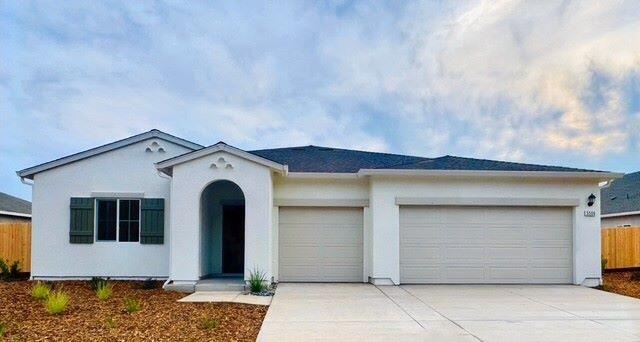 5506 Petal Pl, Redding, CA 96002 - view of front of property with a garage, concrete driveway, and stucco siding
