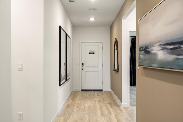 4148 Haleakala Ave, Redding, CA 96001 - hallway with light wood-style flooring and baseboards