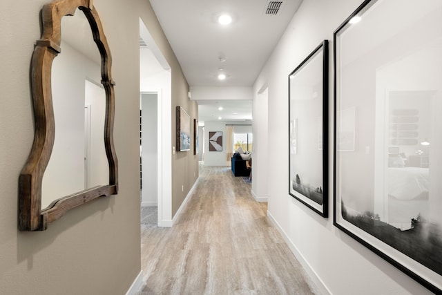 4148 Haleakala Ave, Redding, CA 96001 - hallway featuring light wood finished floors, recessed lighting, and baseboards