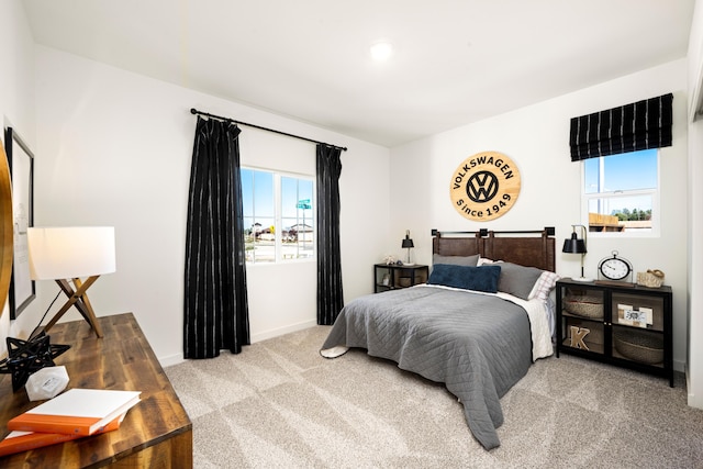 4148 Haleakala Ave, Redding, CA 96001 - bedroom with light colored carpet, multiple windows, and baseboards