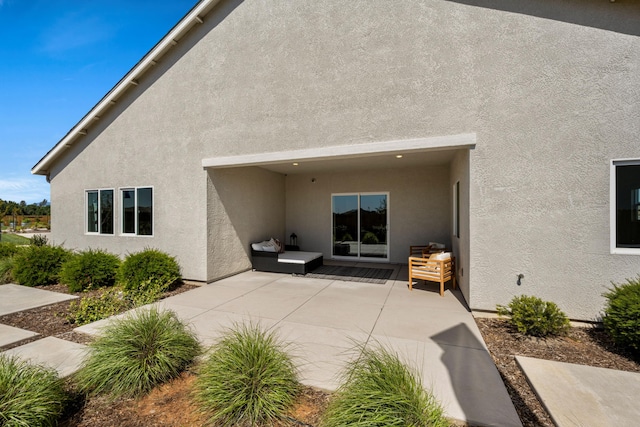 4148 Haleakala Ave, Redding, CA 96001 - rear view of house featuring stucco siding and a patio area