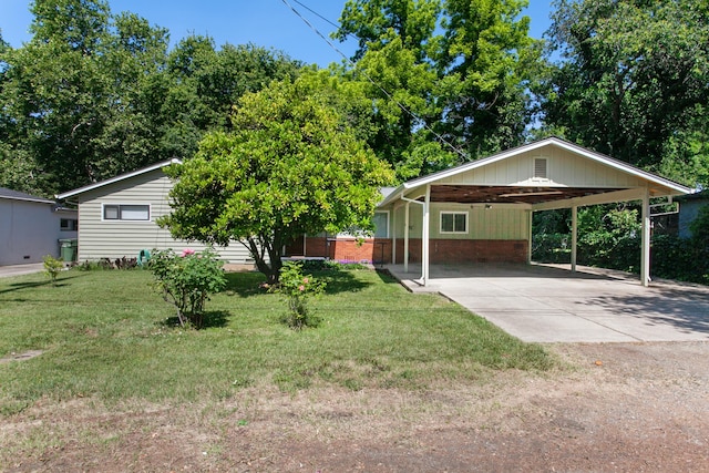 2722 Russell St, Redding, CA 96001 - view of front of house with a front lawn, concrete driveway, a carport, and brick siding
