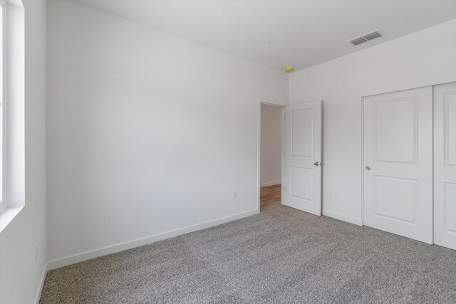 903 Katmai Pl, Redding, CA 96001 - unfurnished bedroom featuring carpet, baseboards, and a closet