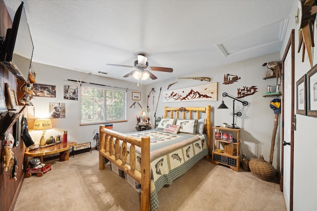 37189 Galena Cir, Burney, CA 96013 - bedroom featuring attic access, light colored carpet, ceiling fan, and a textured ceiling