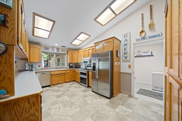 37189 Galena Cir, Burney, CA 96013 - kitchen with appliances with stainless steel finishes, vaulted ceiling, light countertops, and a sink