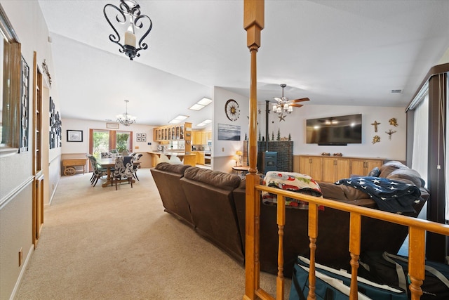 37189 Galena Cir, Burney, CA 96013 - living area featuring vaulted ceiling, light colored carpet, a chandelier, and a ceiling fan