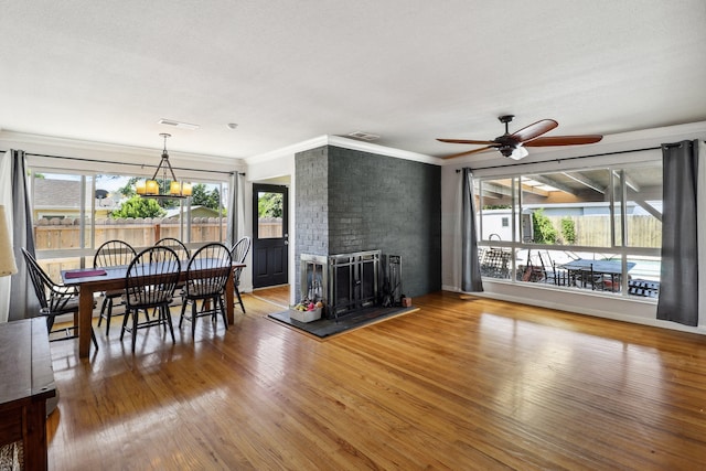 5801 Mountain View Dr, Redding, CA 96003 - living room with plenty of natural light, ceiling fan, wood finished floors, and ornamental molding
