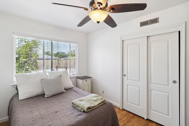 5801 Mountain View Dr, Redding, CA 96003 - bedroom with light wood-style floors, a closet, a ceiling fan, and baseboards