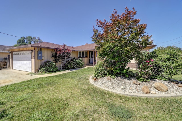 5801 Mountain View Dr, Redding, CA 96003 - ranch-style home featuring an attached garage, board and batten siding, a front yard, and concrete driveway