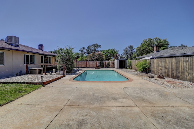 5801 Mountain View Dr, Redding, CA 96003 - view of swimming pool featuring a patio, cooling unit, and a fenced backyard