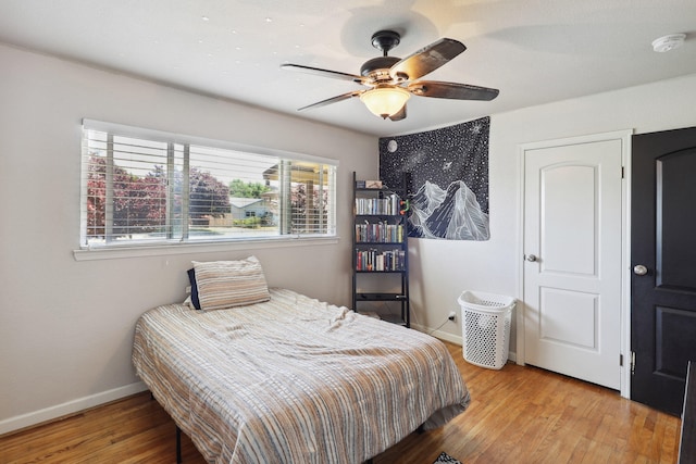 5801 Mountain View Dr, Redding, CA 96003 - bedroom featuring wood finished floors, baseboards, and ceiling fan
