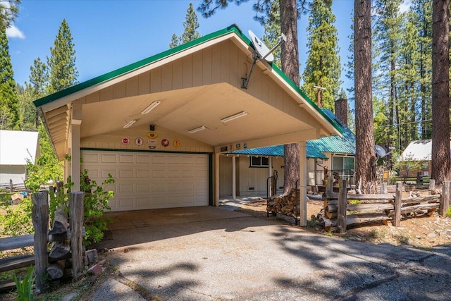 38290 Battle Creek Ave, Mineral, CA 96063 - view of front of home with a garage, asphalt driveway, a carport, and a chimney