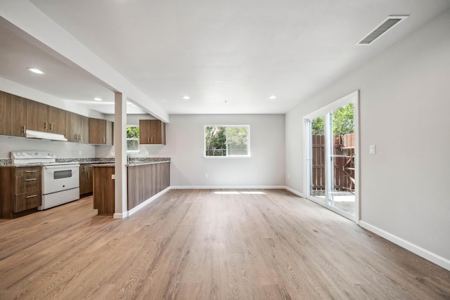 628 Hartnell Ave, Redding, CA 96002 - unfurnished living room with healthy amount of natural light, light wood-style floors, baseboards, and recessed lighting