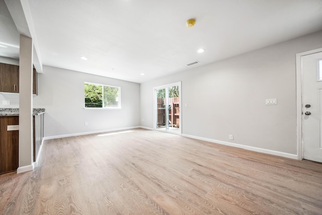 628 Hartnell Ave, Redding, CA 96002 - unfurnished living room with light wood-style floors, recessed lighting, and baseboards