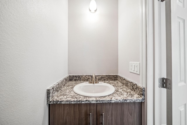 628 Hartnell Ave, Redding, CA 96002 - bathroom featuring vanity and a textured wall