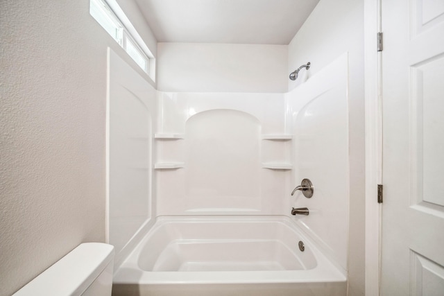 628 Hartnell Ave, Redding, CA 96002 - bathroom with toilet, shower / washtub combination, and a textured wall