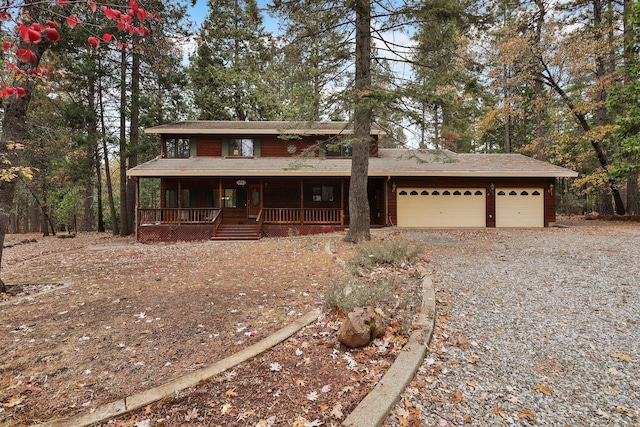 31272 Woodridge Dr, Shingletown, CA 96088 - rustic home with covered porch, a garage, and gravel driveway